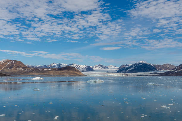 istock Arctic landscape with mountain and glacier in Svalbard in summer time 1219555111