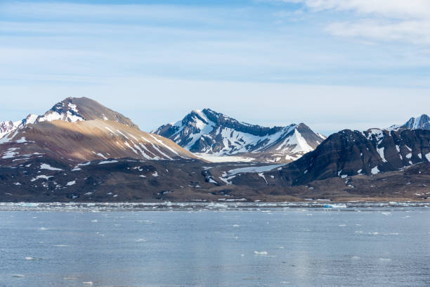 istock Arctic landscape with mountain and glacier in Svalbard in summer time 1219555166