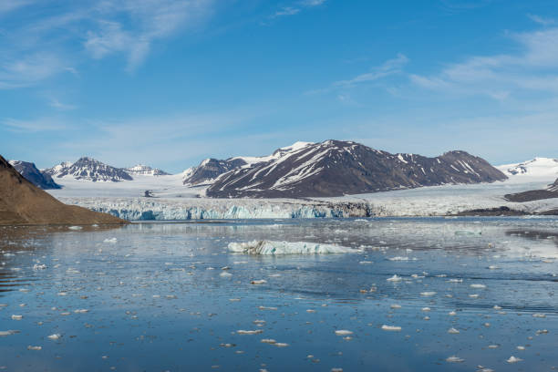 istock Arctic landscape with mountain and glacier in Svalbard in summer time 1219555675