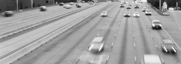 istock Panoramic long exposure aerial view rush hour traffic in Southwest freeway in downtown Houston, Texas 1219556150