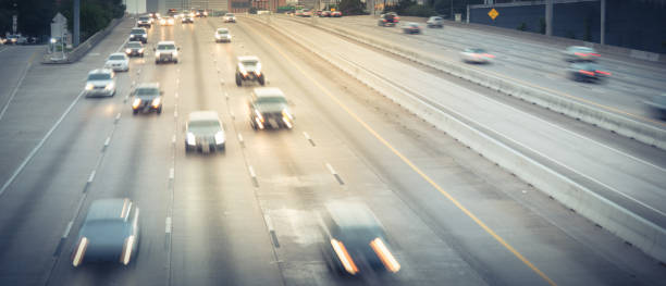 istock Panoramic long exposure aerial view rush hour traffic in Southwest freeway in downtown Houston, Texas 1219556171