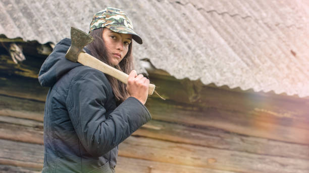 istock girl with an ax looks around 1219556217
