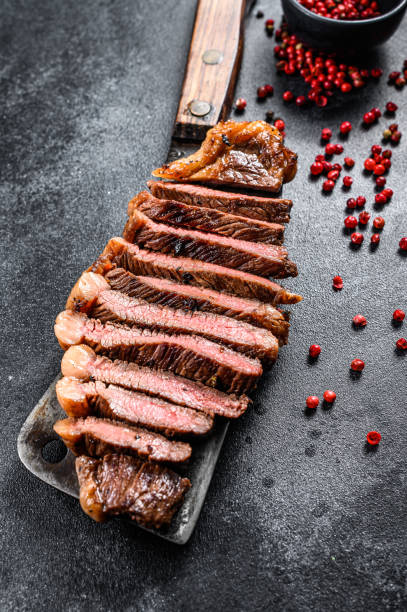 istock Grilled marbled beef steak. Black background. Top view 1219557297