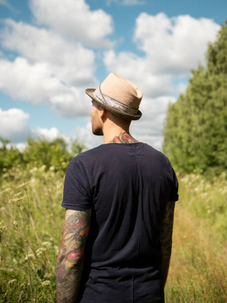Free Stock Photo of Man Standing in Field With Arm Tattoo | Download ...