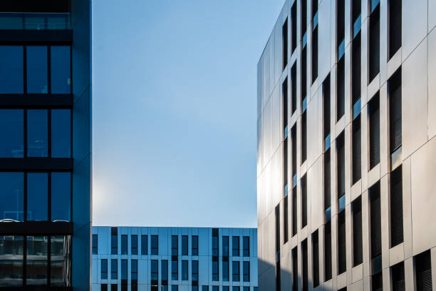 istock Different types of modern office building facades in front of blue evening sky 1219558291