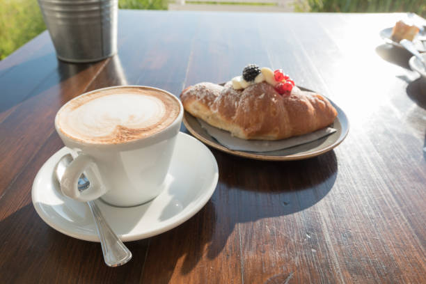 istock Breakfast at the beach with pasta and capuccino 1219558633