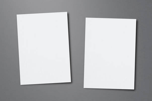 Blank paper sheets for brochure on grey background, top view. Mock up stock photo