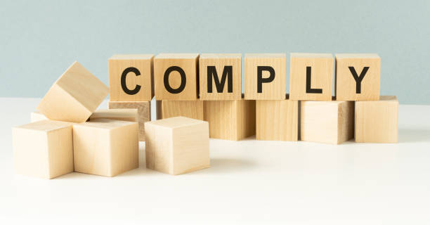 istock COMPLY word made with building blocks on a light background 1219561022