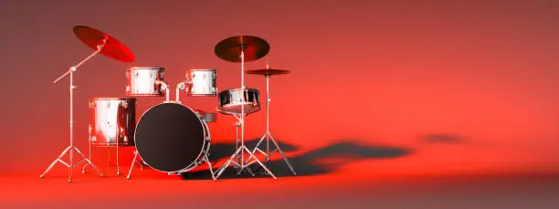 Photo of drum kit on a red background