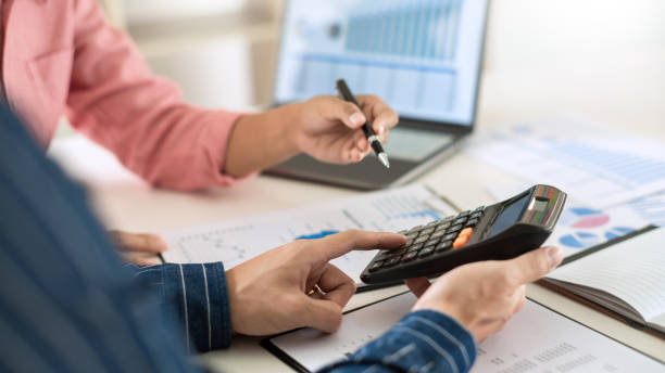 istock Business team working with plan on office desk with new startup project analyzing financial document data charts and graphs in Meeting and successful teamwork Concept 1219564573
