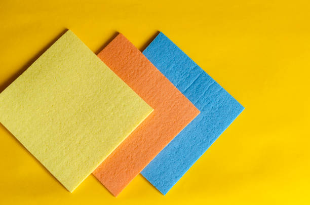 istock Kitchen napkins for cleaning on a yellow background. 1219564733
