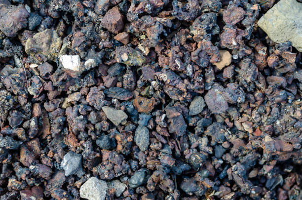 Slag from burnt coal. Slag from burnt coal. Coal ash close-up. Coal solid residue texture. Abstract multitask background. Selective focus. slag heap stock pictures, royalty-free photos & images