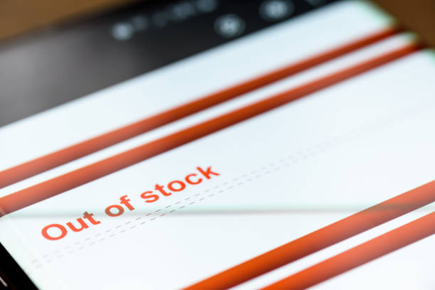 istock out of stock text on smart phone screen 1219565796