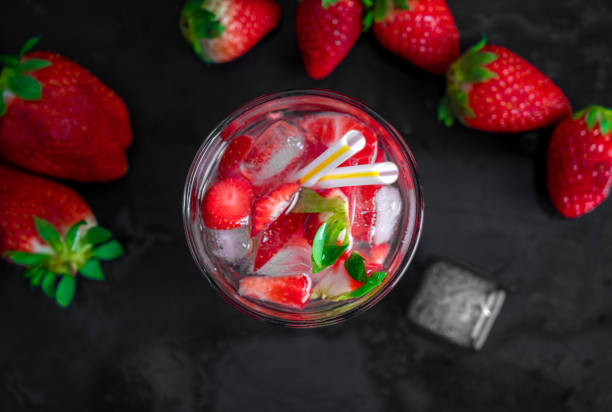 istock strawberry cocktail with strawberry on a black background 1219566062
