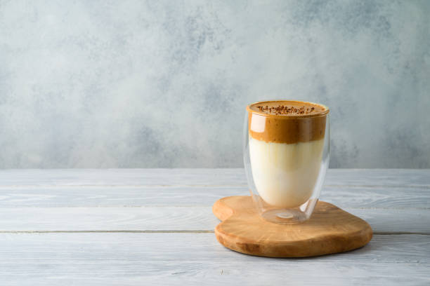 istock Dalgona coffee or whipped coffee drink with milk on wooden table 1219568588