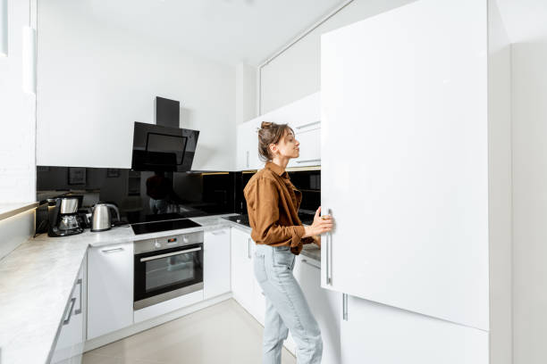 istock Woman on the modern kitchen at home 1219569851