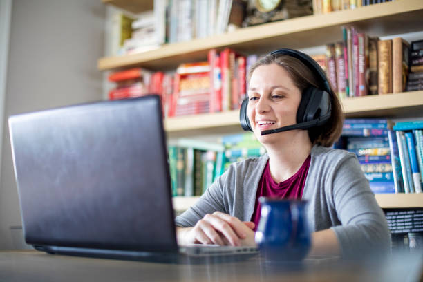 istock Beautiful young woman working from home 1219572563