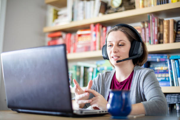 istock Beautiful young woman working from home 1219572588