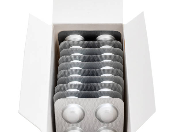 istock A large stack of tablets in a silver package on a white background, close-up, mock up. Prevention and treatment of diseases, viruses, coronavirus, flu and colds. The idea of medicine and healthcare 1219574133