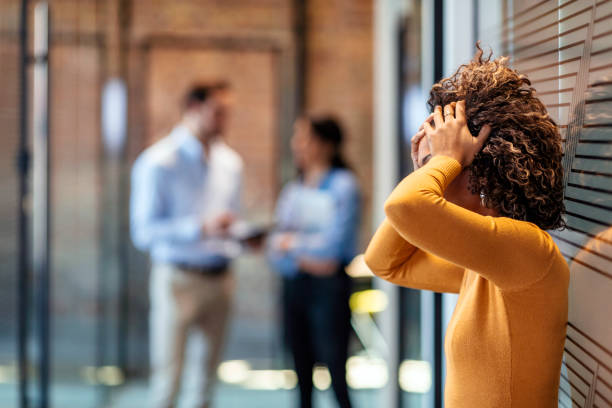 female african american office worker reacts negatively to bad news - behavior office men sadness imagens e fotografias de stock
