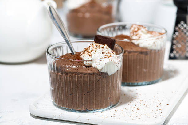 istock sweet chocolate mousse with whipped cream 1219580463