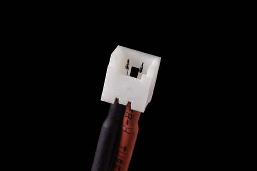 Micro jst 1.25 2 pin female plug isolated on black. Standard connector for small RC vehicles, batteries and motors