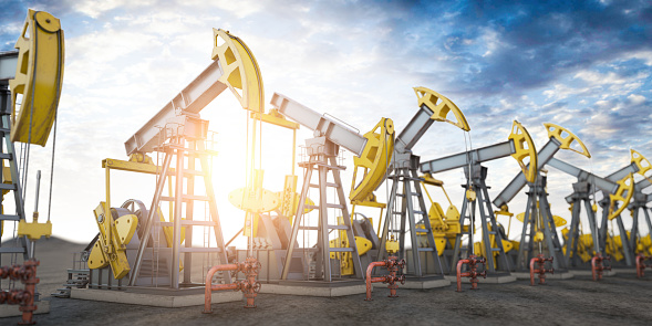 Oil pump jack imn a row. Oil production and extraction concept. 3d illustration