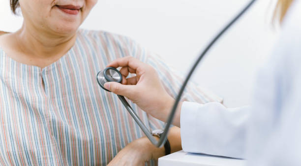 istock doctor using stethoscope to exam patient heart 1219583864