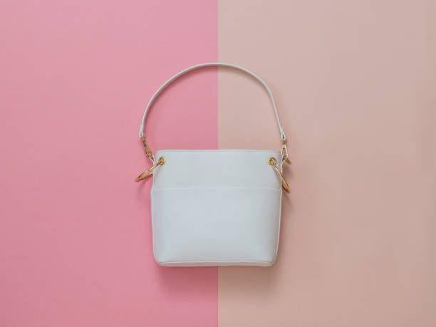 istock White women's leather bag on a red and pink background. Flat lay. 1219585311