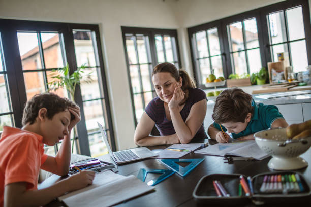 istock Mother homeschooling boys in self-isolation 1219588525
