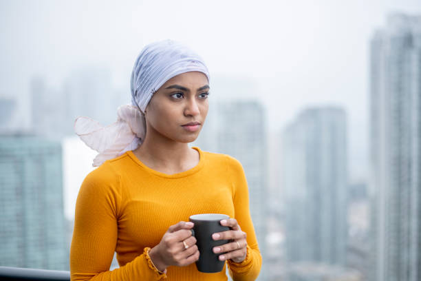 istock Young oncology patient contemplates life 1219589108