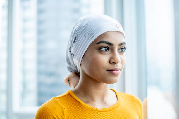istock Young oncology patient contemplates life 1219589112