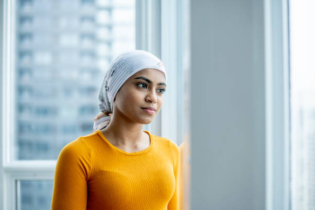 istock Young oncology patient contemplates life 1219589118
