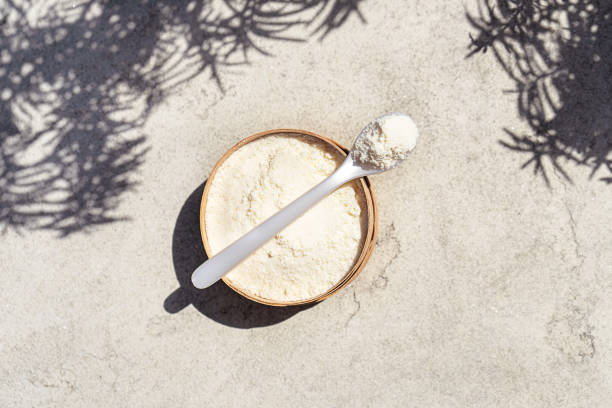 Closeup collagen with a spoon on concrete background.