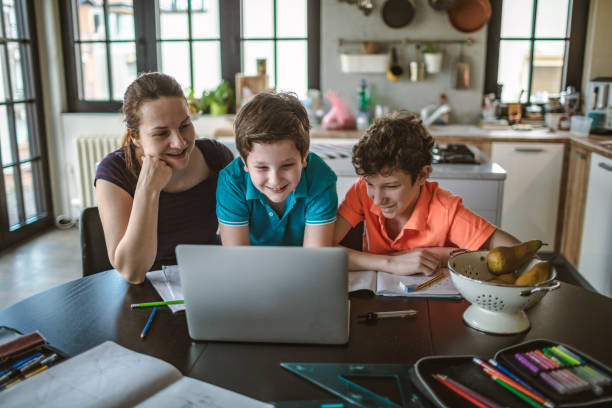 istock Mother homeschooling boys in self-isolation 1219589232