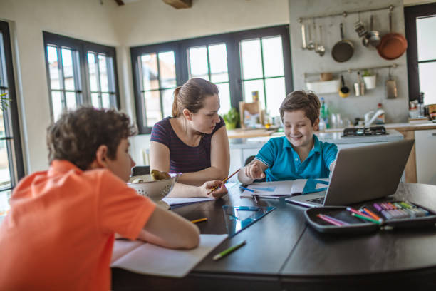 istock Mother homeschooling boys in self-isolation 1219589397