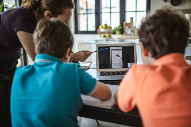 istock Mother homeschooling boys in self-isolation 1219591226