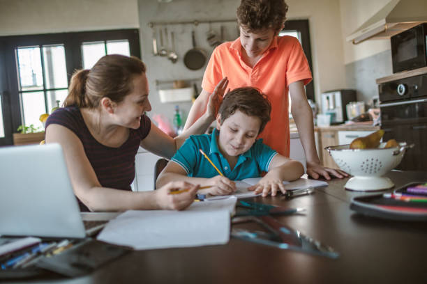 istock Mother homeschooling boys in self-isolation 1219591393