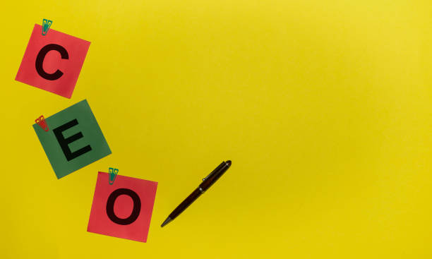 istock CEO (Chief Executive Officer) acronym on red and green sticky notes and pen on yellow background 1219592546