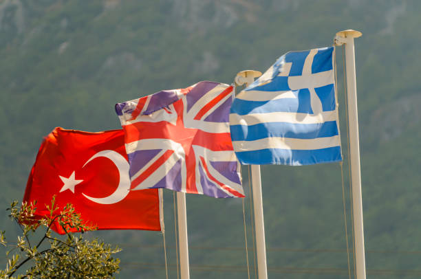 istock Turkish, British UK and Greek flags flying together 1219592842