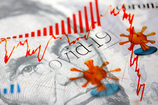 istock Covid-19 headlines and a dollar banknote 1219593498