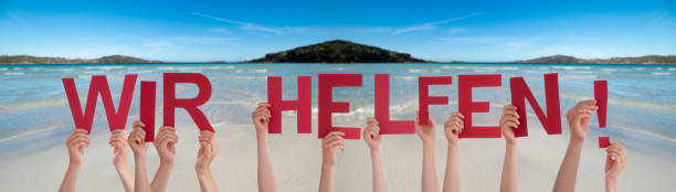 istock People Hands Holding Word We Help Means We Help, Ocean Background 1219593523