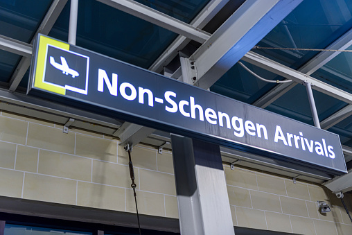 Sign at the arrivals hall of a European airport, advising that this is the entrance for non-schengen arrivals.