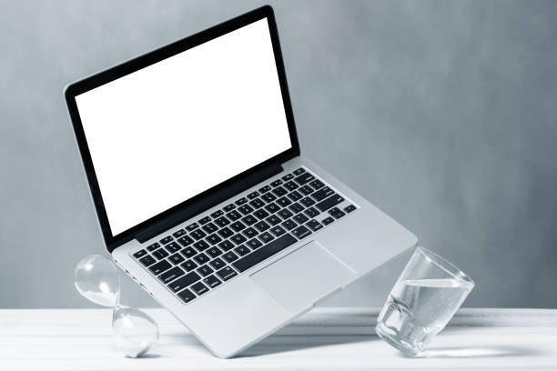 istock Laptop mockup, computer with blank screen flying under the table. Symbol of lightness freshness airiness. Modern technologies social networks and applications. Copy space 1219594596