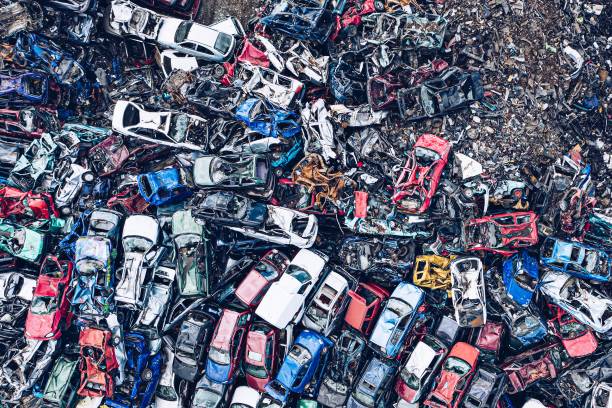 istock Smashed destroyed car wrecks on car junkyard. 1219595217