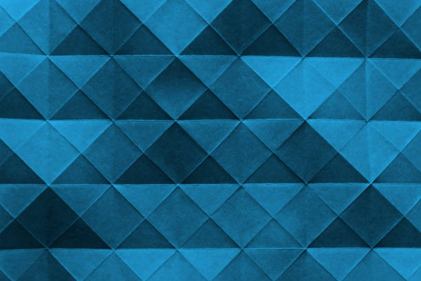 istock Multiple blue triangles from shadows and folded lines of paper. 1219595310