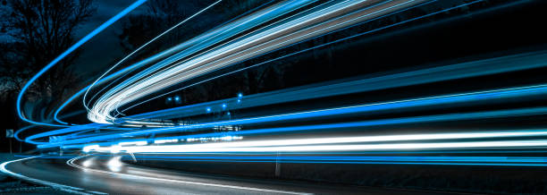 istock blue car lights at night. long exposure 1219595413