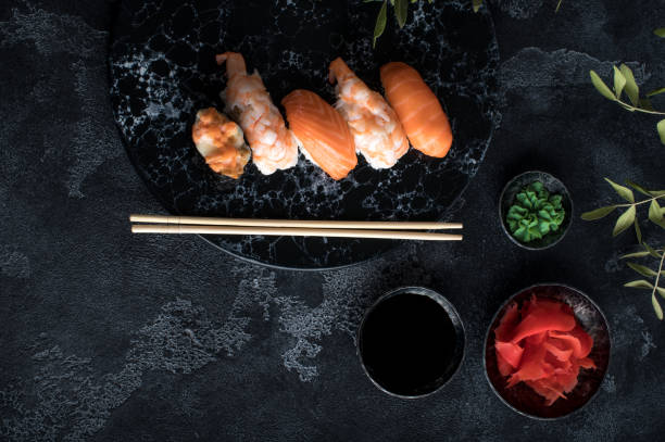 istock Close up of sashimi sushi set on black background 1219595711
