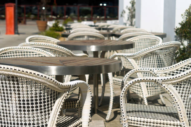 istock Empty tables and chairs at street cafe 1219598429