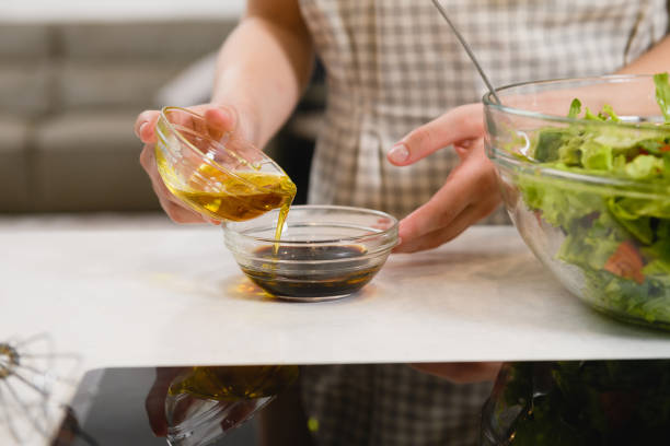 istock Hands mix oil with sauce at bowl 1219599346